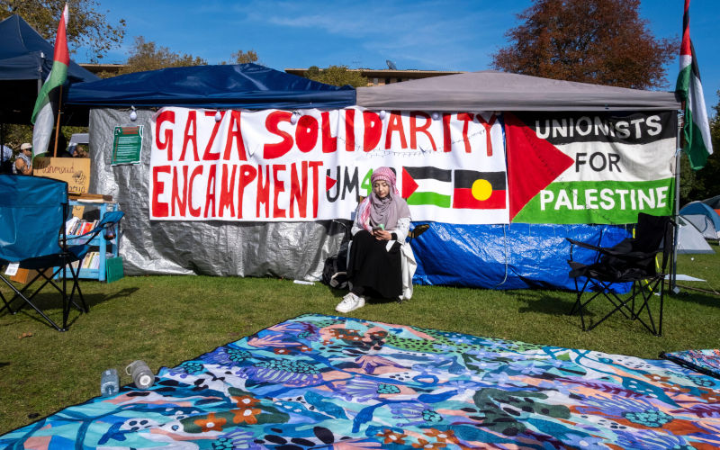 An Arabic woman at the students pro-Palestinian encampment in the grounds of Melbourne University. Melbourne, Victoria, Australia. Image Alamy/ Michael Thomas / Alamy Stock Photo
