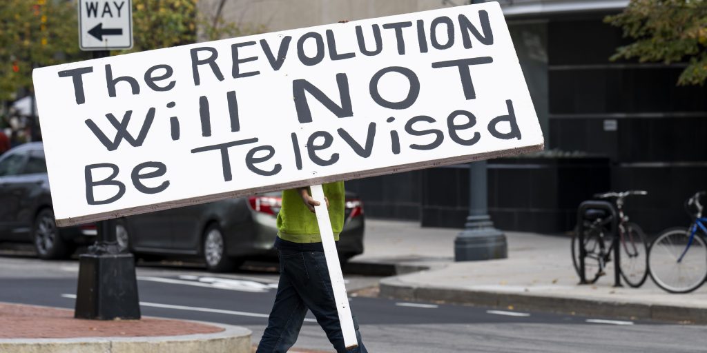 A man carries a large sign to the Palestinian rights protest in Washington on Saturday, November 4, 2023. (Bill Clark/CQ-Roll Call, Inc via Getty Images)