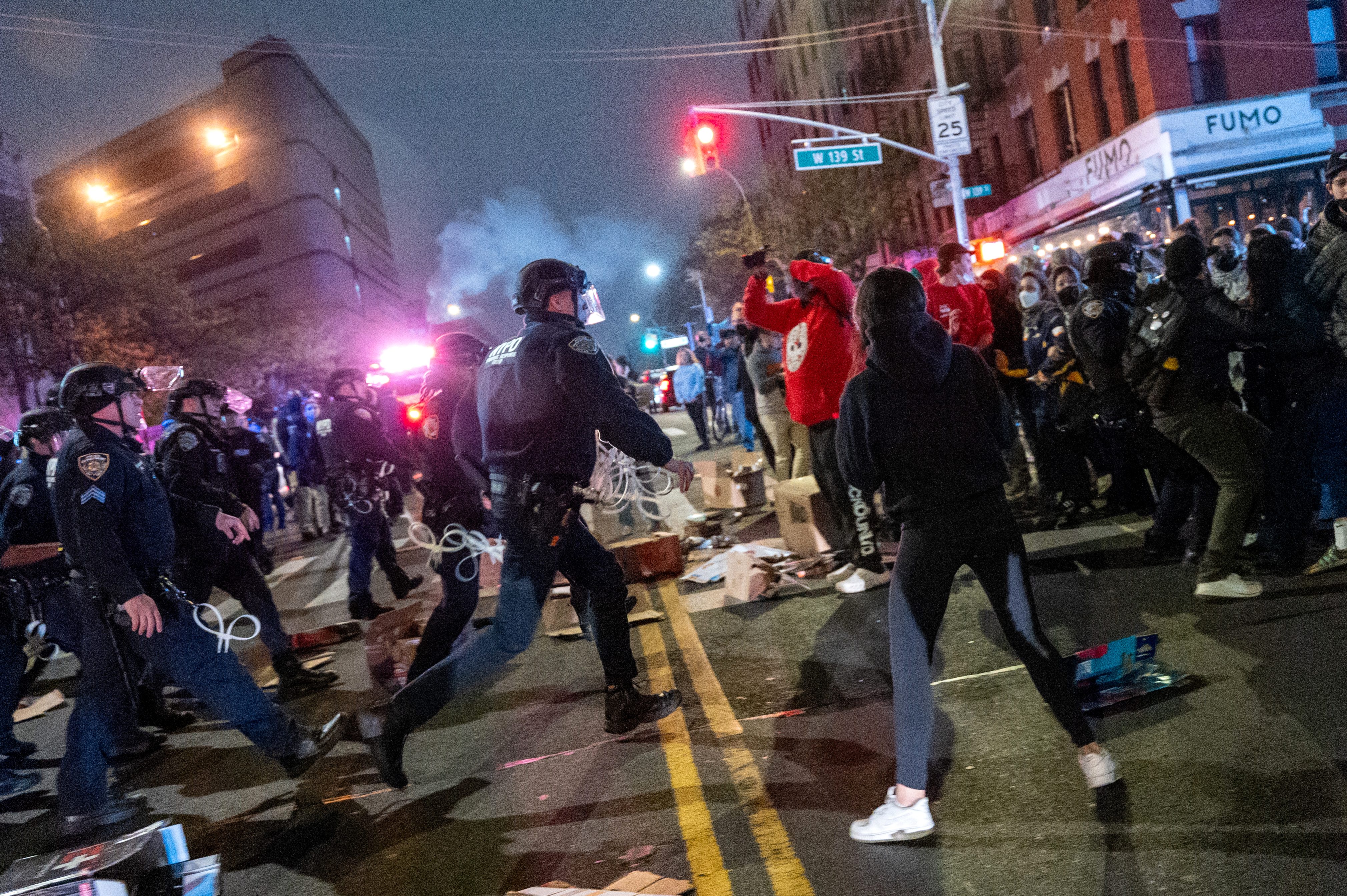 NEW YORK, NEW YORK - APRIL 30: Pro-Palestinian supporters confront police during demonstrations at The City College Of New York (CUNY) as the NYPD cracks down on protest camps at both Columbia University and CCNY on April 30, 2024 in New York City. A heavy police presence surrounded both campuses on Tuesday as local law enforcement cleared tent encampments set up by pro-Palestinian protesters. Classes at both schools have been moved virtually to online learning in response to the recent campus unrest. (Photo by Spencer Platt/Getty Images)