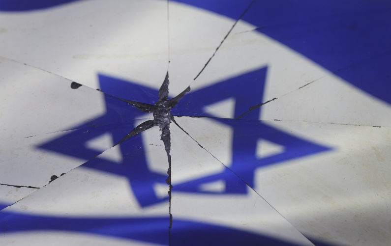 Israel flag is reflected in broken mirror