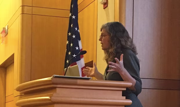 Stacy Gilbert at lectern 