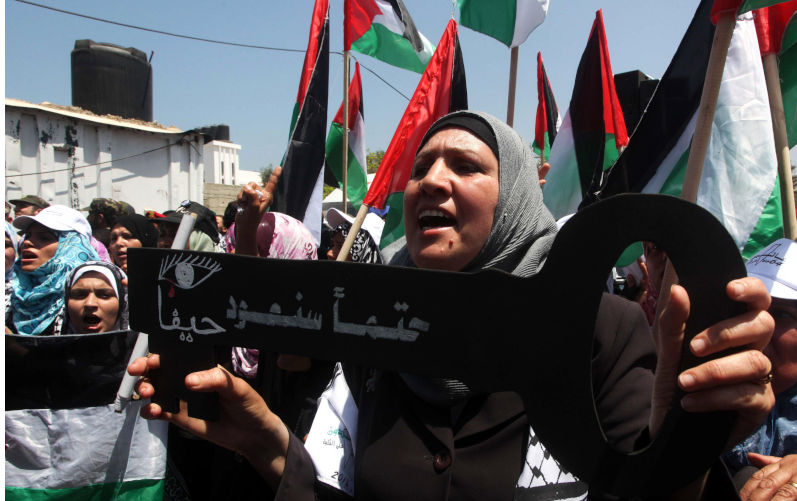 Palestinian Territory - Palestinians hold keys symbolising keys to houses left by Palestinians in 1948. Palestinians take part in a mass demonstration in front of UN headquarters of UNESCO marking Nakba when Palestinians were forced to leave their homes, after I. May 14, 2012 - Gaza City, Gaza Strip,