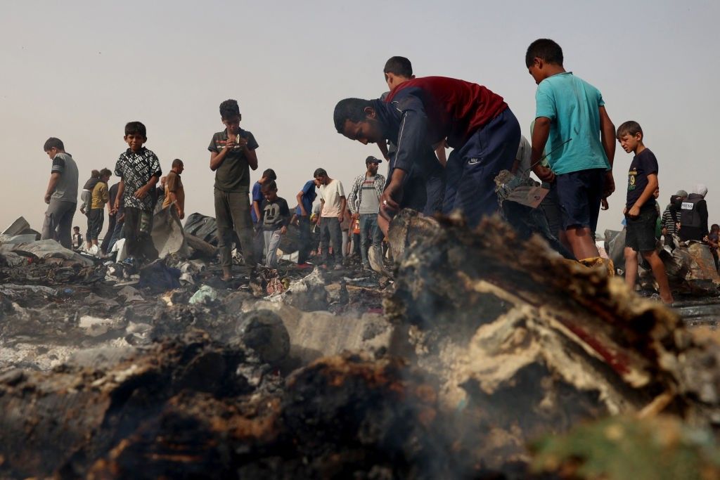 Palestinians in the aftermath of massacre on Rafah tent encampent on May 27, 2024